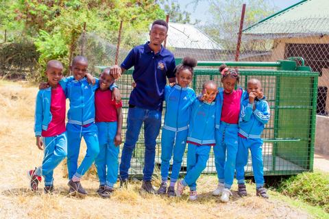 A teacher with pupils on a school outing