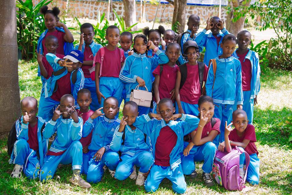 Jupe Hills students wearing blue tracksuits for sports and games