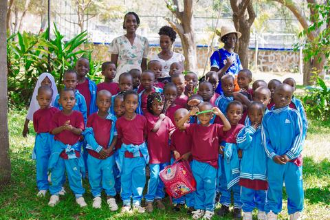 Young Jupe Hills pupils standing with three teachers